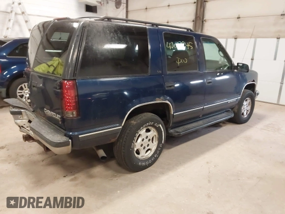 1999 Chevrolet Tahoe Z71 with VIN 1GNEK13R5XJ548832, listed as a IAAI auction lot 42077245 with 208,875 mi miles and . Bid and sale history available at DreamBid. Image 4.