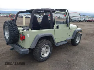 2001 Jeep Wrangler Sport with VIN 1J4FA49S91P354668, listed as a IAAI auction lot 41883227 with 197,043 mi miles and . Bid and sale history available at carsss.com. Image 4.