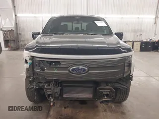 2023 Ford F-150 Lightning Pro with VIN 1FTVW1EL4PWG22900, listed as a IAAI auction lot 42139391 with 6,569 mi miles and . Bid and sale history available at DreamBid. Image 13.