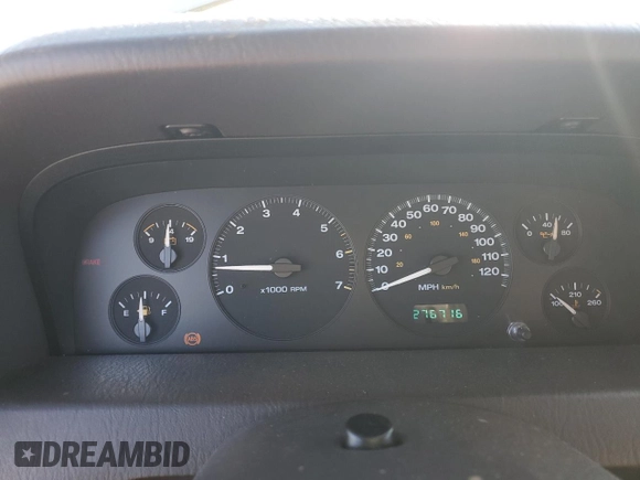 1999 Jeep Grand Cherokee Laredo z VIN 1J4GW58NXXC704719, wystawiony jako Copart lot #49546395 z przebiegiem 276 716 mil mil oraz Czysty tytuł • Clean title. Historia ofert i sprzedaży dostępna na DreamBid. Obrazek 9.