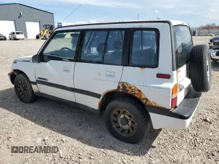 1995 Suzuki Sidekick z VIN JS3TD03V4S4113472, wystawiony jako Copart lot #51279074 z przebiegiem 199 736 mil mil oraz Tytuł czysty. Historia ofert i sprzedaży dostępna na DreamBid. Obrazek 2.