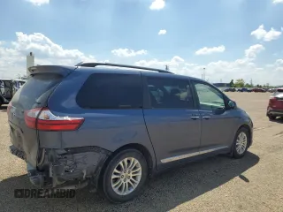 2015 Toyota Sienna XLE with VIN 5TDYK3DC4FS619385, listed as a Copart auction lot 57090385 with 112,896 mi miles and Salvage title. Bid and sale history available at DreamBid. Image 3.