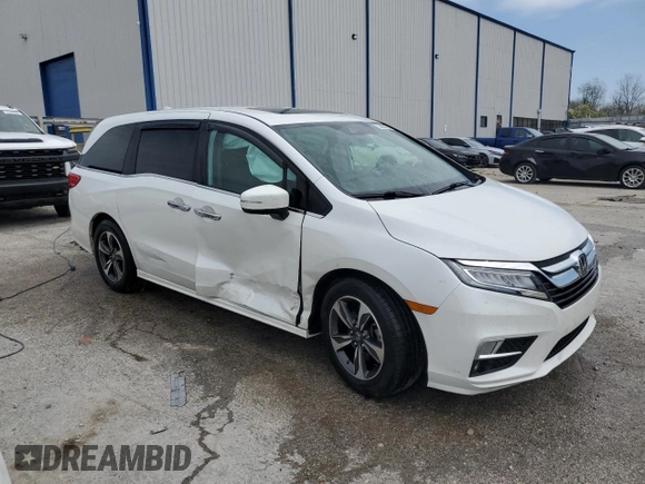2020 Honda Odyssey Touring with VIN 5FNRL6H8XLB019365, listed as a Copart auction lot 52404335 with 59,486 mi miles and Salvage Title. Bid and sale history available at DreamBid. Image 4.