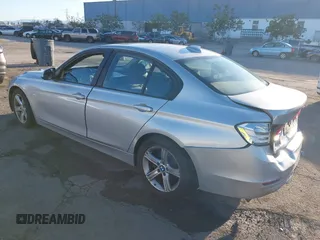 2013 BMW 3 Series 320i with VIN WBA3B1C53DK129703, listed as a IAAI auction lot 41295234 with 175,506 mi miles. Bid and sale history available at carsss.com. Image 3.