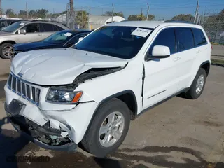 2014 Jeep Grand Cherokee Laredo with VIN 1C4RJEAGXEC130399, listed as a IAAI auction lot 41861664 with 106,925 mi miles. Bid and sale history available at carsss.com. Image 21.
