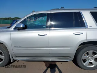 2015 Chevrolet Tahoe LTZ with VIN 1GNSKCKC5FR205739, listed as a IAAI auction lot 40020644 with 142,524 mi miles and . Bid and sale history available at DreamBid. Image 14.