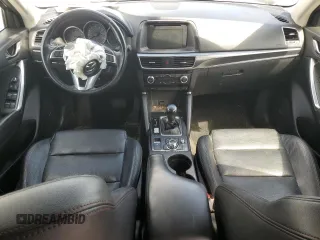 2016 Mazda CX-5 Grand Touring z VIN JM3KE2DY9G0645141, wystawiony jako Copart lot #50989635 z przebiegiem 123 898 mil mil oraz Szkoda całkowita • Salvage title. Historia ofert i sprzedaży dostępna na DreamBid. Obrazek 8.
