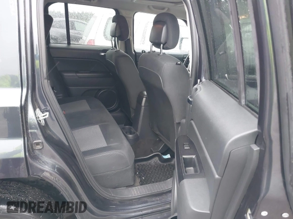 2014 Jeep Patriot Latitude with VIN 1C4NJRFB6ED689459, listed as a IAAI auction lot 42197469 with 202,899 mi miles. Bid and sale history available at carsss.com. Image 8.
