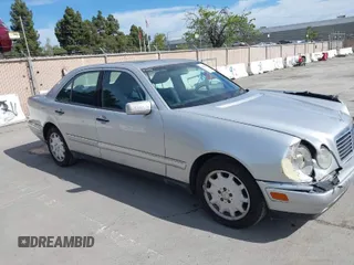 1998 Mercedes-Benz E-Class with VIN WDBJF65F5WA702626, listed as a IAAI auction lot 42014815 with 113,632 mi miles. Bid and sale history available at carsss.com. Image 1.