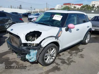 2014 MINI Countryman S with VIN WMWZC3C52EWP26869, listed as a IAAI auction lot 41756310 with 91,941 mi miles and . Bid and sale history available at DreamBid. Image 2.