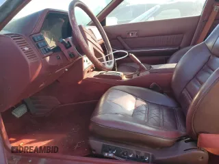 1985 Nissan 300ZX z VIN JN1HZ16S9FX050874, wystawiony jako Copart lot #72283704 z przebiegiem 139 895 mil mil oraz Tytuł czysty. Historia ofert i sprzedaży dostępna na DreamBid. Obrazek 7.