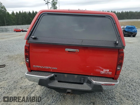 2010 GMC Canyon SLE1 z VIN 1GTJTCDE8A8111482, wystawiony jako Copart lot #57779275 z przebiegiem 64 409 mil mil oraz Szkoda całkowita • Salvage title. Historia ofert i sprzedaży dostępna na DreamBid. Obrazek 6.