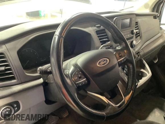 2020 Ford Transit Cargo z VIN 1FTBR1Y8XLKB06141, wystawiony jako IAAI lot #42642640 z przebiegiem 123 417 mil mil oraz . Historia ofert i sprzedaży dostępna na DreamBid. Obrazek 26.