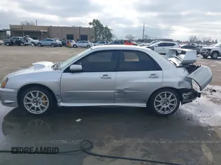 2005 Subaru Impreza Sedan (Natl) WRX STi w/Gold Wheels with VIN JF1GD70675L510065, listed as a IAAI auction lot 41092820 with 90,641 mi miles. Bid and sale history available at carsss.com. Image 14.