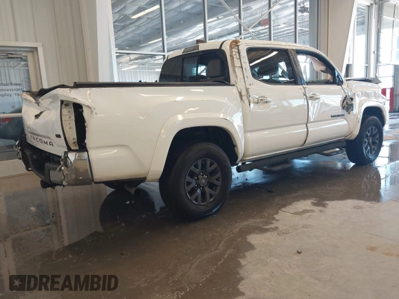 2020 Toyota Tacoma SR5 with VIN 3TMAZ5CN5LM124703, listed as a IAAI auction lot 41017478 with 47,627 mi miles and . Bid and sale history available at DreamBid. Image 4.