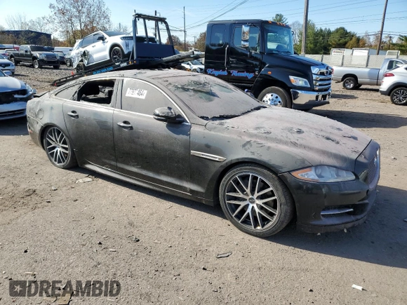 2015 Jaguar XJ with VIN SAJWJ1CD1F8V90815, listed as a Copart auction lot 77977464 with Not provided miles and Salvage title. Bid and sale history available at DreamBid. Image 4.