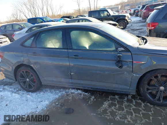 2019 Volkswagen Jetta GLI S z VIN 3VW6T7BU6KM209458, wystawiony jako IAAI lot #41334724 z przebiegiem 53 634 mil mil oraz . Historia ofert i sprzedaży dostępna na DreamBid. Obrazek 13.