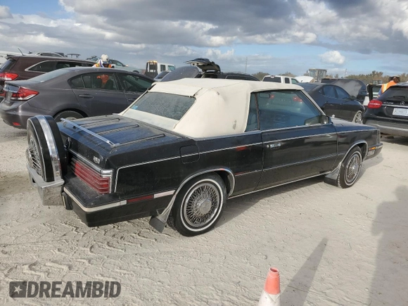 1985 Chrysler LeBaron Mark Cross z VIN 1C3BC55E0FG160918, wystawiony jako Copart lot #76659284 z przebiegiem Nie podano mil oraz Szkody całkowita. Historia ofert i sprzedaży dostępna na DreamBid. Obrazek 3.
