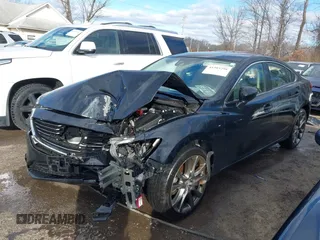 2016 Mazda 6 i Grand Touring with VIN JM1GJ1W54G1454115, listed as a IAAI auction lot 41203298 with 104,632 mi miles and . Bid and sale history available at DreamBid. Image 2.