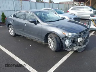 2014 Mazda 6 i Grand Touring with VIN JM1GJ1W63E1147380, listed as a IAAI auction lot 41928637 with 140,091 mi miles and . Bid and sale history available at DreamBid. Image 1.
