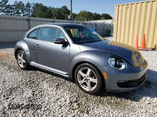 2014 Volkswagen Beetle 2.5L w/Sun with VIN 3VWJP7AT4EM612608, listed as a Copart auction lot 74679104 with 141,559 mi miles and Salvage Title. Bid and sale history available at DreamBid. Image 4.