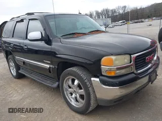 2003 GMC Yukon SLT with VIN 1GKEK13Z93R233525, listed as a IAAI auction lot 41541832 with 311,440 mi miles. Bid and sale history available at carsss.com. Image 1.